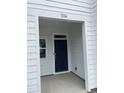 Front porch entrance with modern black door and a clear view of the house number 1116 at 1116 Merlot Hills Ln, Durham, NC 27704