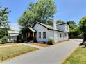 Side view of the house with the driveway at 114 N Guthrie Ave, Durham, NC 27703