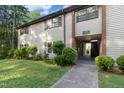 Inviting condo featuring tidy landscaping, charming shutters, and clearly marked unit numbers at 1208 Manassas Ct # A, Raleigh, NC 27609