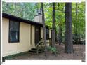 Charming home exterior featuring a small porch and wood siding at 125 Forsyth Dr, Chapel Hill, NC 27517