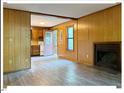 Open living area with a fireplace and views into the kitchen at 125 Forsyth Dr, Chapel Hill, NC 27517