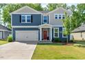 Beautiful two-story home with a well-maintained lawn and inviting front entrance at 128 Potomac River St, Garner, NC 27529