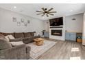 Spacious living room featuring a fireplace, ceiling fan and recessed lighting at 128 Potomac River St, Garner, NC 27529