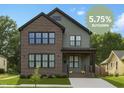 Beautiful two-story home with brick and siding exterior, professionally landscaped yard at 1405 Watts St, Durham, NC 27701