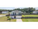 Charming two-story home with a two-car garage and a spacious fenced backyard and playground at 171 Piney Field Rd, Fuquay Varina, NC 27526