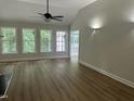 Spacious living room with beautiful floors and natural light from large windows at 2032 Sherry Lynn Dr, Garner, NC 27529