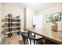 Home office includes a built-in bookshelf, modern desk, and wood floors at 209 Broomgrove Way, Wake Forest, NC 27587