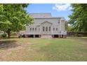 Expansive backyard featuring a large wooden deck, perfect for entertaining and outdoor relaxation at 3208 Wilbon Ridge Dr, Holly Springs, NC 27540