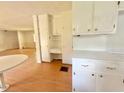 Bright eat-in kitchen boasts white cabinets and a spacious layout at 3716 Rivermont Rd, Durham, NC 27712