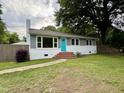 Charming single-story home featuring a bright blue front door and brick steps at 3804 Cobb St, Garner, NC 27529