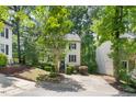 Two-story home with manicured landscaping, complimented with mature trees at 6 Weathergreen Ct, Durham, NC 27713