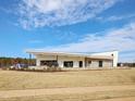 Modern community center showcasing sleek architectural design and a well-maintained lawn at 673 Leland Hill Circle, Zebulon, NC 27597