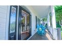Inviting front porch featuring classic rocking chairs, offering a relaxing outdoor living space at 8042 Hogan Dr, Wake Forest, NC 27587