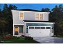 Charming two-story home with gray siding, white trim, a front-entry garage, and colorful landscaping at 840 Ottawa Dr, Garner, NC 27529
