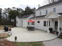 Spacious patio with an outdoor dining set and basketball hoop, perfect for entertaining at 100 Lager Ln, Garner, NC 27529