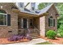 Close-up of front entrance with brick stairs and metal railings at 1016 Luminary Ln, Willow Springs, NC 27592