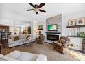 Spacious living room featuring a fireplace, comfortable seating and dining space at 10520 Sablewood Dr # 103, Raleigh, NC 27617