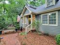 Inviting home exterior with bench seating and well-maintained landscaping, creating a warm and welcoming atmosphere at 107 Long Shadow Ln, Cary, NC 27518