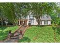 Charming two-story home features an attractive front entrance and lush landscaped yard at 108 Hotelling Ct, Chapel Hill, NC 27514