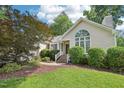 Charming single-story home featuring a landscaped front yard and large front window for natural light at 1102 Laurens Way, Knightdale, NC 27545