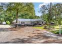 Gravel driveway provides ample parking and access to home and outbuilding at 155 G Herring Rd, Princeton, NC 27569