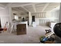 Open-concept living space featuring unfinished kitchen with white cabinetry at 168 Clayton Rd, Princeton, NC 27569