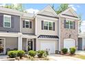 Townhome showcasing mixed facade, neat lawn, and welcoming front entrance at 174 Walking Path Pl, Hillsborough, NC 27278