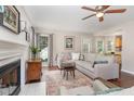 Inviting living area with hardwood floors, fireplace, and views to the dining area at 209 Woodstar Dr, Cary, NC 27513