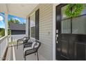 Cozy front porch featuring comfortable seating and a welcoming entrance at 225 Alcock Ln, Youngsville, NC 27596
