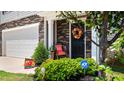 Inviting front door with seasonal wreath and security system sign at 2406 Lily Dr, Haw River, NC 27258