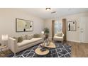 Bright living room featuring a modern sofa, decorative rug, and stylish coffee tables, creating an inviting space at 2519 Hitchcock Dr, Durham, NC 27705
