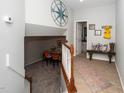 Welcoming foyer with decor, stairs to another room, and hardwood floors at 3034 Winfred Dell Ln, Cary, NC 27511