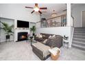 Comfortable living room with cozy fireplace, plush seating and staircase access at 3034 Winfred Dell Ln, Cary, NC 27511