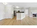 Inviting living room with a cozy fireplace and adjacent kitchen, great for Gathering gatherings at 340 Allister Dr # 301, Raleigh, NC 27609