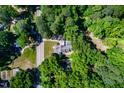 Overhead view of home on a lot surrounded by mature trees at 4220 Hope Valley Road Rd, Durham, NC 27707