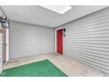 Enclosed entrance way with red door and horizontal siding at 501 Gooseneck Dr # B2, Cary, NC 27513