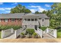 Charming condo building with dual walkways and beautiful landscaping at 501 Gooseneck Dr # B2, Cary, NC 27513