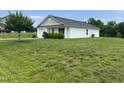 Well maintained house sits on large lot with mature tree on the property at 5219 Merlin Dr, Snow Camp, NC 27349
