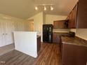 Efficient kitchen with dark cabinets, modern appliances, and ample countertop space at 5219 Merlin Dr, Snow Camp, NC 27349