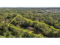 Aerial view of a home surrounded by lush forest, highlighting the expansive property and natural setting at 5900 Ebenezer Church Rd, Raleigh, NC 27612