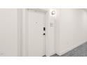 Apartment hallway with unit number 215 and a modern, clean aesthetic at 615 Daniels St # 215, Raleigh, NC 27605