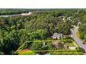 An aerial view of a house with its property lines marked in yellow for estimation at 624 Powhatan Dr, Fuquay Varina, NC 27526