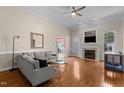 Bright living room featuring a fireplace, hardwood floors, and neutral color scheme at 624 Powhatan Dr, Fuquay Varina, NC 27526