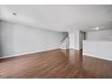 Spacious living room with hardwood floors and natural light, perfect for entertaining or relaxing at 8630 Neuse Landing # 105, Raleigh, NC 27616