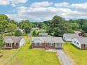 A charming residential neighborhood with tree-lined streets and well-maintained homes at 102 Pine St, Dunn, NC 28334