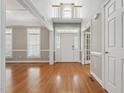 Elegant entryway with hardwood floors, a soaring ceiling, and abundant natural light at 105 Bagley Ln, Dunn, NC 28334