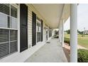 Spacious covered front porch with stately columns, offering ample space for relaxing and enjoying the outdoors at 105 Bagley Ln, Dunn, NC 28334