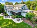 Aerial view of the backyard showing a screened in porch, multiple patios, and landscaping at 125 Lord Ashley Rd, Raleigh, NC 27610