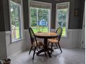Charming breakfast nook featuring natural lighting and updated flooring at 154 Hillsdale Dr, Archer Lodge, NC 27527