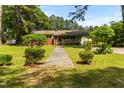 Brick home with a front porch, featuring manicured shrubs and a walkway at 1709 Whitfield Ave, Rocky Mount, NC 27801